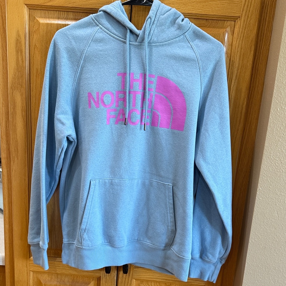 The North Face Light Blue Hoodie with Vibrant Pink Logo